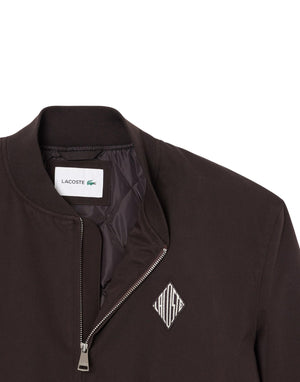 Lacoste Bomber impermeabile con stemma rétro Giubbotto uomo marrone immagine 2