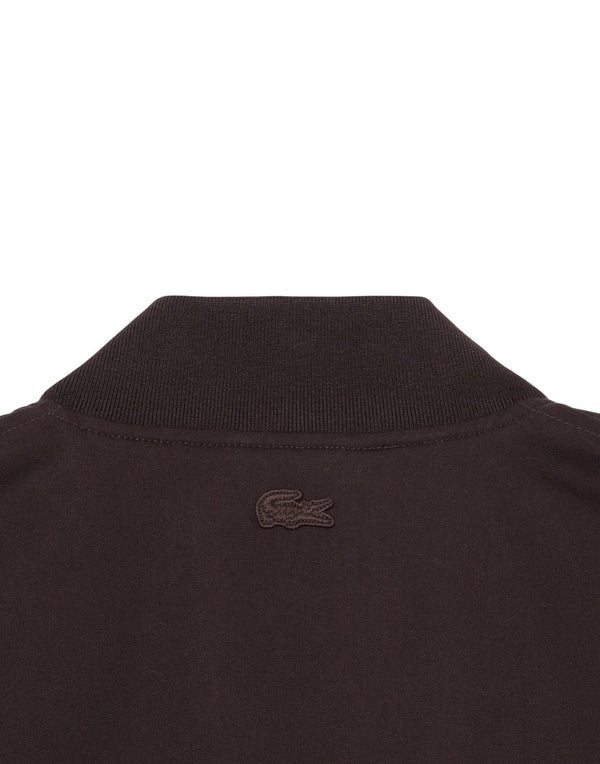 Lacoste Bomber impermeabile con stemma rétro Giubbotto uomo marrone immagine 4